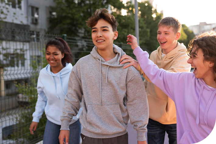 Teenage friends smiling together, representing adolescent care at RightCare Family Medicine in Raleigh, NC